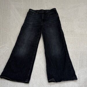 7 for all Mankind Wide-Leg Black Denim Jeans.